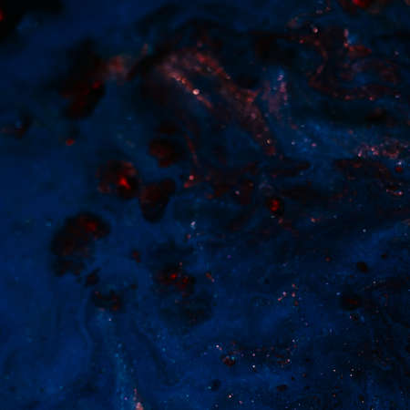Abstract dark blue gradient paint background. Acrylic texture pattern with red sparkles. Rough uneven surface. Design idea.の写真素材