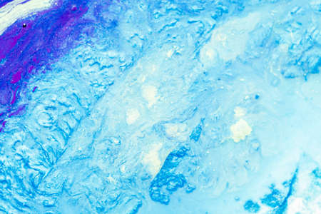 Abstract art textured background. Dried polish design. Beautiful sky blue paint with shimmering...