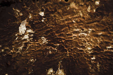 Abstract art texture background. Melting chocolate with milk design. Brown and white paints with ripple effect.の写真素材
