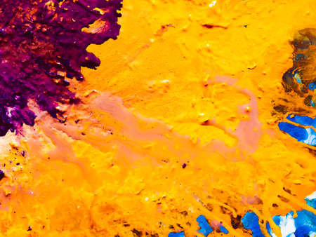 Abstract purple yellow blue paint background. Color fluid mix flowing. Acrylic liquid blend art...