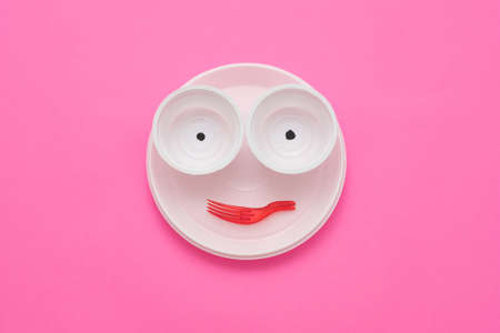 Environmentally friendly waste disposing. Garbage monster face made of empty plastic tableware.の写真素材