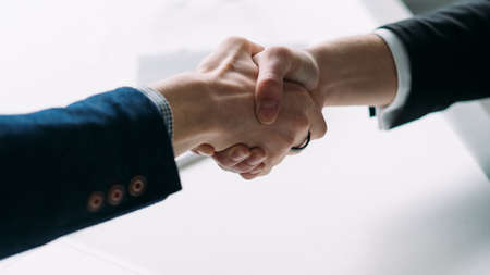 Successful partnership. Professional cooperation and agreement. Closeup of handshake. Business people making a deal.