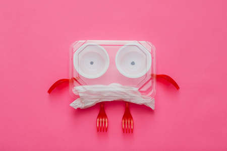 Anti plastic campaign. Ecology concept. Garbage monster on pink background. Environmental...