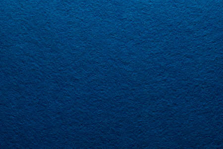 Navy blue felt texture abstract art background. Colored fabric fibers surface. Empty space.の写真素材