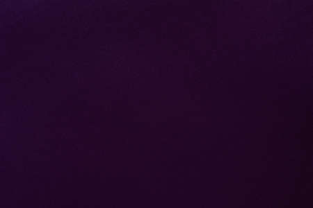 Dark purple felt texture abstract art background. Colored fabric fibers surface. Empty space.の写真素材
