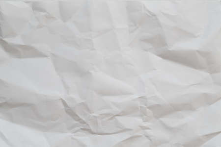 White crumpled paper abstract art background. Wrinkled texture effect. Copy space.の写真素材