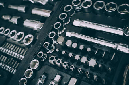 Mechanic essential instruments. Closeup of chrome wrench tools organized in box.の写真素材