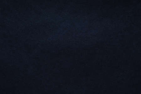 Black felt texture abstract art background. Colored fabric fibers surface. Empty space.の写真素材