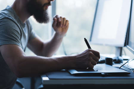Web graphic design. Cropped shot of creative illustrator using tablet and pen for drawing. Copy space.の写真素材