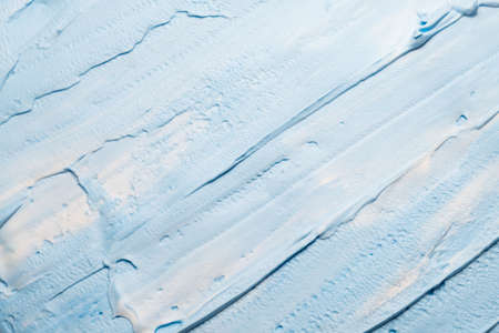 Sky blue acrylic paint. Creative abstract background. Closeup of brushstrokes texture surface.
