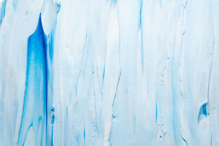 Blue and white acrylic paint art background. Colored foam abstract design wallpaper.の写真素材