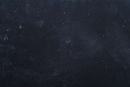 Dust and scratches design. Dark blue grunge abstract background. Distressed surface. Copy space.の写真素材