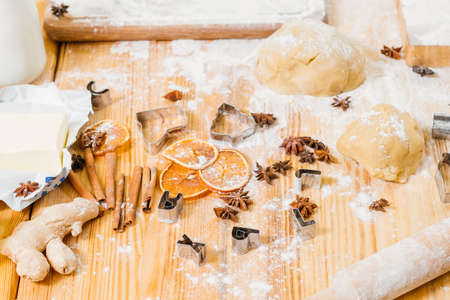 Homemade pastry. Kitchen table mess. Ingredients and tools for making gingerbread biscuits.の写真素材