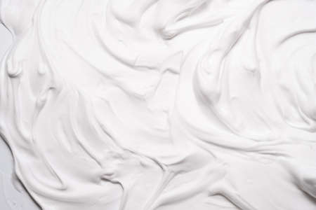 White foam texture abstract art background. Airy mousse decorative pattern wallpaper.の写真素材