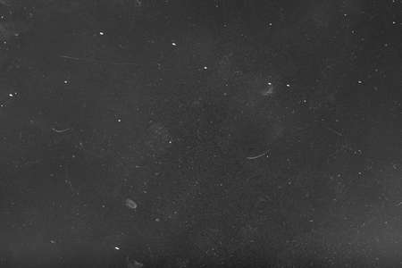 Grainy overlay. Abstract background. White dust and scratches over gray surface. Empty space.の写真素材