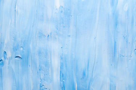 Blue and white acrylic paint art background. Colored foam abstract design wallpaper.の写真素材