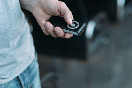Wireless multimedia equipment. Cropped shot of man holding remote control to switch program. Copy...