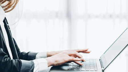 Business correspondence. Cropped shot of female office worker typing on laptop keyboard. Copy space.の写真素材