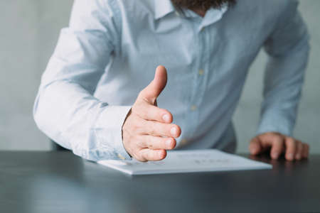 Human resources. Cropped shot of HR manager holding out hand to greet applicant. Copy space.