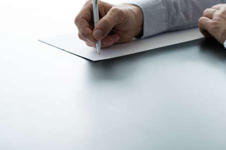 Resignation notice. Cropped shot of male employee quitting job, writing formal letter. Copy space.の写真素材