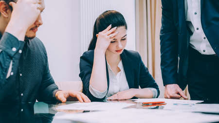 Family law. Divorce problems. Depressed man and woman at the attorney lawyer office.の写真素材