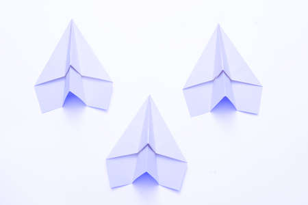 Business competition. Three sky blue paper airplanes isolated on white background. Copy space.