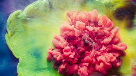Ink water explosion. Fantasy cloud. Pink yellow fume. Abstract art background.の写真素材