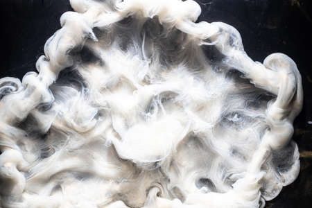 Ink water explosion. Toxic waste. White fog effect. Abstract art background.