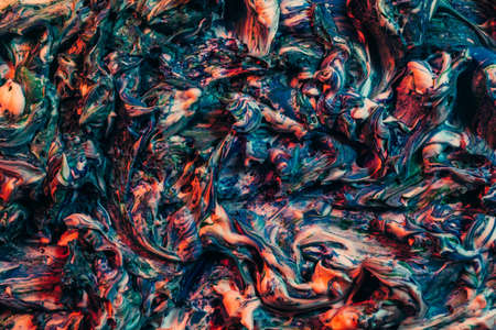 Colorful abstract art background. Teal blue and red wet acrylic paint mix. Toothpaste effect.の写真素材