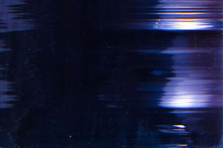 Blue dusty overlay. Aged filmstrip. Glowing flecks on dark background.
