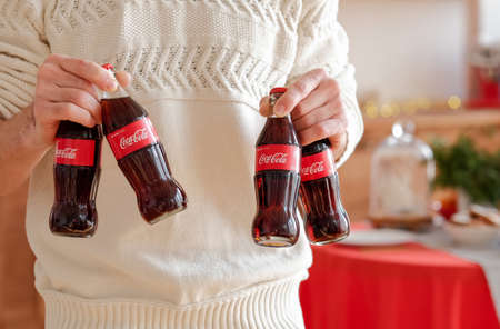 Kharkiv, Ukraine - November 8, 2018: Coca Cola in glass bottles. Christmas party drink.のeditorial素材