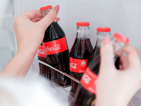 Kharkiv, Ukraine - November 8, 2018: Coca Cola in glass bottles in fridgeのeditorial素材