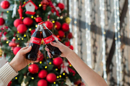 Kharkiv, Ukraine - November 8, 2018: Coca Cola in glass bottles. New Year party beverage.のeditorial素材