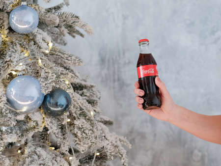Kharkiv, Ukraine - November 8, 2018: Coca Cola in glass bottles. Christmas party drink.のeditorial素材