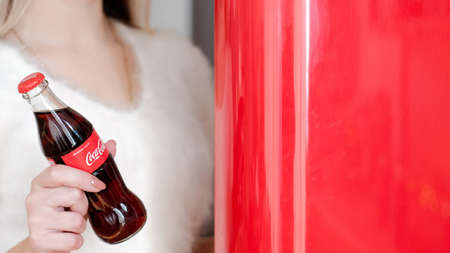 Kharkiv, Ukraine - November 8, 2018: Coca Cola in glass bottles. Christmas party drink.のeditorial素材