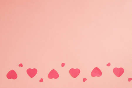 Romantic greeting card. Creative heart pattern pale pink background. Copy space.