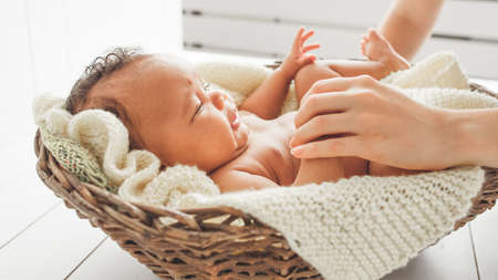 Newborn wellbeing. Mother care protection. Mom checking on disturbed baby.の写真素材