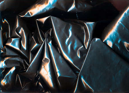 Shiny crushed wrapping paper with glitch.の写真素材