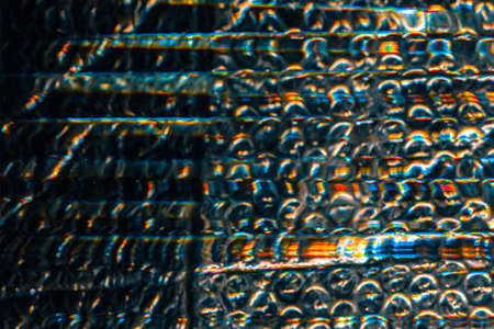 Iridescent abstract background.  wrap texture. Crushed transparent film with glitch.