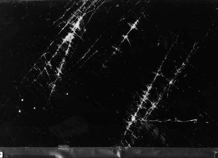 Broken glass overlay. Fractured texture. Black damaged computer screen effect.の写真素材