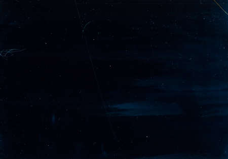 Dust scratches overlay. Aged filmstrip. Navy blue distressed screen with smeared dirt effect.の写真素材
