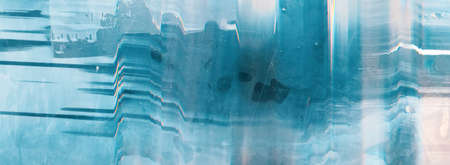 Blue abstract background. Glitch defect. Dust scratches white noise on distressed surface.の写真素材
