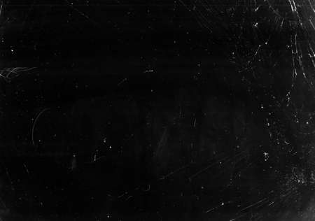Broken window glass. Fractured screen texture. Black distressed display with white dust scratches.の写真素材