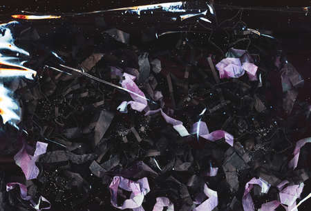 Grunge abstract background. Paper shred composition. Black purple wrinkled strips with glitter effect.の写真素材