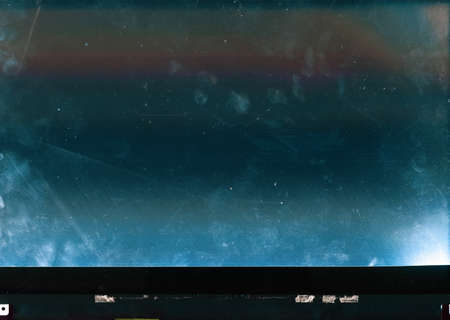Old screen overlay. Scratched laptop display. Teal blue orange gradient stain surface with dust...