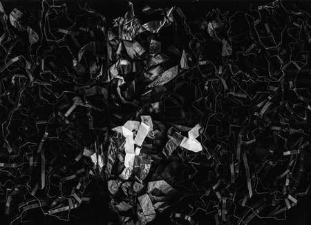 Grunge abstract background. Shredded paper texture. Black white crushed foil arrangement.