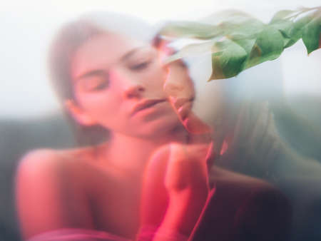 Nature portrait. Beauty wellness. Sensual woman with bare shoulders blur silhouette in neon red...