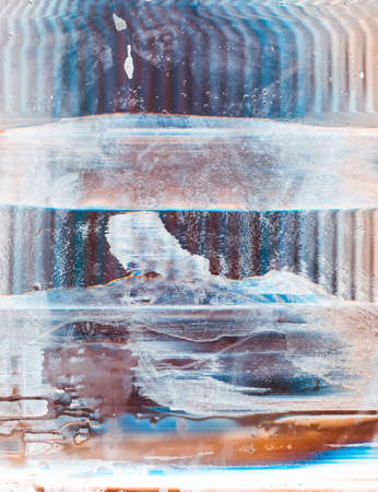 Color glitch background. Stained screen. Blue rusty glass with noise scratches water drops.