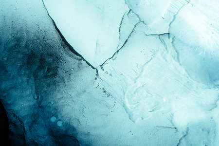 Blue acrylic ink. Marble texture. Fractured ice design. Frozen water surface abstract background....