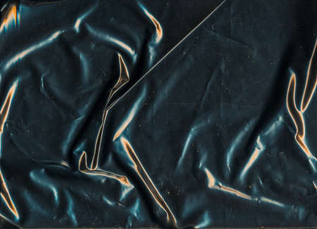 Aged grunge background. Paper scratched texture. Rusty wrinkles dust on black surface.の写真素材